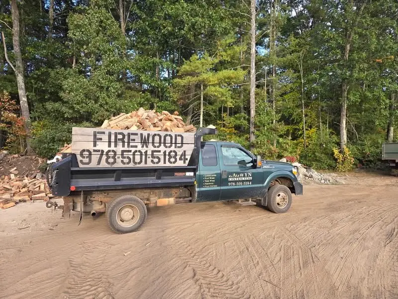 Dump truck delivering a load of firewood to a customer